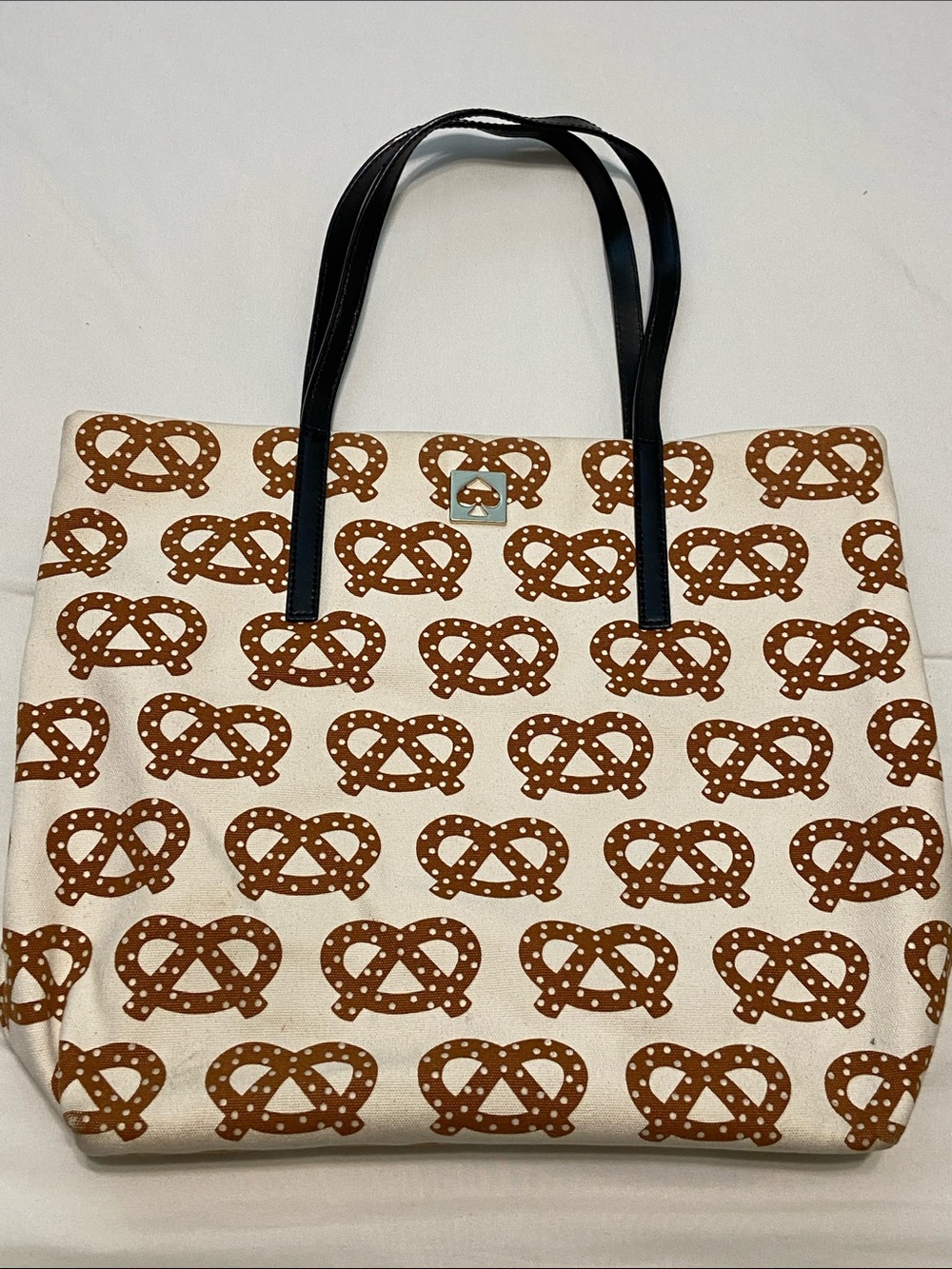 Kate Spade Beige Canvas Tote with Brown Pretzel Print and leather Straps